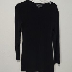 A long t-shirt or a solid black mini dress, designed by Vanessa Riley.